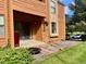 Backyard area has sliding doors to the patio, green lawn, and mature landscaping at 4281 S Salida Way # 5, Aurora, CO 80013