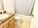 Bathroom includes a vanity, toilet, and shower tub with patterned shower curtain at 4281 S Salida Way # 5, Aurora, CO 80013
