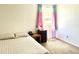 Bright bedroom features carpet floors, closet, and colorful window coverings at 4281 S Salida Way # 5, Aurora, CO 80013