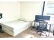 Bright bedroom boasts a desk setup with dual monitors and large windows at 4281 S Salida Way # 5, Aurora, CO 80013