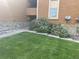Building exterior with lush landscaping with well manicured lawn and flowering shrubs at 4281 S Salida Way # 5, Aurora, CO 80013