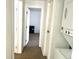 Hallway featuring access to the bedrooms, laundry room, and other areas of the house at 4281 S Salida Way # 5, Aurora, CO 80013