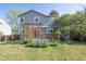 Two-story home backyard featuring a trellis, garden, and a well-maintained lawn at 2935 Bow Line Pl, Longmont, CO 80503