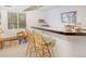 Finished basement featuring a stylish bar area, wooden stools, and natural light at 2935 Bow Line Pl, Longmont, CO 80503