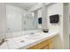 Bright bathroom with a large mirror, tiled counter and shower at 2935 Bow Line Pl, Longmont, CO 80503