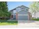 Inviting two-story home with a well-maintained front yard, brick accents and an attached two-car garage at 2935 Bow Line Pl, Longmont, CO 80503