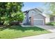 Charming two-story home with a well-manicured lawn, attached garage, and beautiful curb appeal at 2935 Bow Line Pl, Longmont, CO 80503