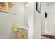 Clean half bathroom with a vanity, mirror, and neutral decor at 2935 Bow Line Pl, Longmont, CO 80503