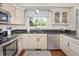 Modern kitchen featuring stainless steel appliances, granite countertops, and ample cabinet space at 2935 Bow Line Pl, Longmont, CO 80503