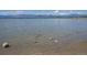Scenic view of the lake and distant mountains on a calm day at 2935 Bow Line Pl, Longmont, CO 80503