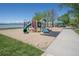 A colorful playground with slides, climbing structures, and a view of the lake at 2935 Bow Line Pl, Longmont, CO 80503