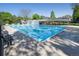Large outdoor swimming pool with covered picnic tables and lounge chairs at 2935 Bow Line Pl, Longmont, CO 80503