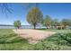Outdoor sand volleyball court near the lake, surrounded by trees at 2935 Bow Line Pl, Longmont, CO 80503
