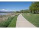 Paved walking path with a view of the mountains and the lake at 2935 Bow Line Pl, Longmont, CO 80503