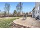 Large backyard with a brick patio and chairs for outdoor relaxation and entertaining at 9306 W 13Th Pl, Lakewood, CO 80215