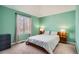 Bedroom featuring neutral carpet, large window, and contemporary furnishings at 9306 W 13Th Pl, Lakewood, CO 80215