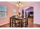 Cozy dining area with view into the living room and hardwood floors at 9306 W 13Th Pl, Lakewood, CO 80215