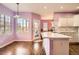 Modern kitchen with white countertops and view into the dining area at 9306 W 13Th Pl, Lakewood, CO 80215