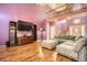 Open-concept living room with hardwood floors, and staircase at 9306 W 13Th Pl, Lakewood, CO 80215