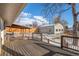 Spacious deck overlooking the backyard with a detached garage at 4070 W Dartmouth Ave, Denver, CO 80236