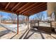 Covered patio and deck overlooking the backyard. Snow covered in winter at 4070 W Dartmouth Ave, Denver, CO 80236