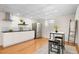 Modern basement kitchen featuring white cabinets and stainless steel appliances at 4070 W Dartmouth Ave, Denver, CO 80236