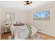 Bright bedroom with wood floors, ceiling fan, and plenty of natural light at 4070 W Dartmouth Ave, Denver, CO 80236