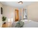 Spacious bedroom with wood floors, large windows, and ample natural light at 4070 W Dartmouth Ave, Denver, CO 80236