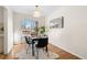 Dining room featuring marble top table and sliding door access at 4070 W Dartmouth Ave, Denver, CO 80236