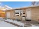 House exterior showcasing entryway and garage at 4070 W Dartmouth Ave, Denver, CO 80236