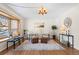 Spacious living room with hardwood floors and a bay window at 4070 W Dartmouth Ave, Denver, CO 80236