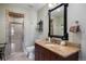 Bathroom featuring granite countertop and tiled shower at 6047 Vacquero Cir, Castle Pines, CO 80108