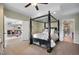 Bedroom with four-poster bed; view to living and bath at 6047 Vacquero Cir, Castle Pines, CO 80108