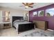 Spacious bedroom with a ceiling fan and three large windows at 6047 Vacquero Cir, Castle Pines, CO 80108