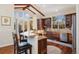 Spacious kitchen with hardwood floors, stainless steel appliances, and a breakfast bar at 6047 Vacquero Cir, Castle Pines, CO 80108