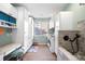 Well-equipped laundry and mudroom with dog-washing station, custom cabinets and countertop space at 6047 Vacquero Cir, Castle Pines, CO 80108