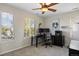 Well-lit office with dual monitors and views of mature trees at 6047 Vacquero Cir, Castle Pines, CO 80108