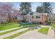 Charming backyard with a patio, table, grill, and beautiful landscaping at 1958 S Pearl St, Denver, CO 80210