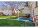 Outdoor patio with a dining table and grill, perfect for entertaining in the well-manicured yard at 1958 S Pearl St, Denver, CO 80210