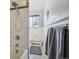 Classic bathroom with white subway tile, shower, and patterned flooring at 1958 S Pearl St, Denver, CO 80210