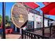 Charming building with a cafe; outdoor seating area, awning, and appealing architectural details at 1958 S Pearl St, Denver, CO 80210