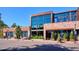 Commercial brick building with large glass windows and modern architectural design, front street view at 1958 S Pearl St, Denver, CO 80210