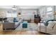 Cozy living room with hardwood floors, natural light, and comfortable seating arrangement at 1958 S Pearl St, Denver, CO 80210