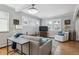 Comfortable living room with neutral colors, hardwood floors and ample sunlight at 1958 S Pearl St, Denver, CO 80210