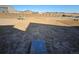 Large, unfinished backyard surrounded by a wooden fence at 490 Grey Rock St, Brighton, CO 80601