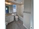Bathroom featuring a tub/shower combination and white vanity with modern sink and faucet at 490 Grey Rock St, Brighton, CO 80601