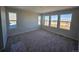 Bright bedroom with large windows and soft carpet at 490 Grey Rock St, Brighton, CO 80601