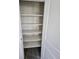 Linen closet features shelving and carpet flooring at 490 Grey Rock St, Brighton, CO 80601