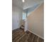 Welcoming entryway with wood-look flooring and natural light from a window above the stairs at 490 Grey Rock St, Brighton, CO 80601