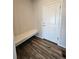 Convenient entryway with a built-in bench and modern flooring, perfect for dropping your bags at 490 Grey Rock St, Brighton, CO 80601